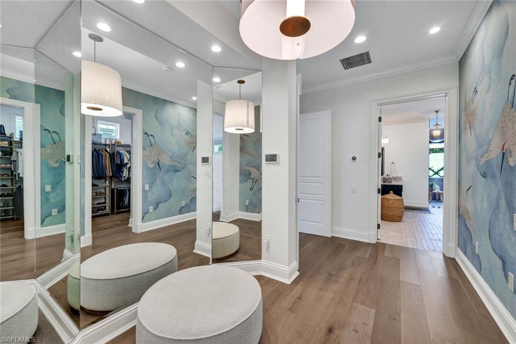 445 Putter Point Drive Naples, FL 34103 - Photo 18 of 44 a bathroom with a sink a toilet and shower