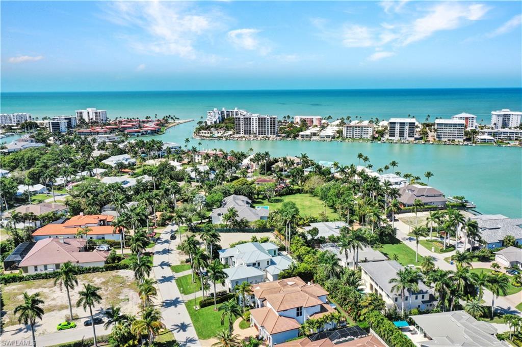 445 Putter Point Drive Naples, FL 34103 - Photo 2 of 44 an aerial view of a city with lots of residential buildings