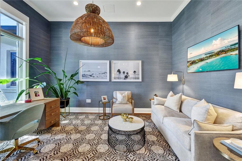 445 Putter Point Drive Naples, FL 34103 - Photo 25 of 44 a living room with furniture and a potted plant