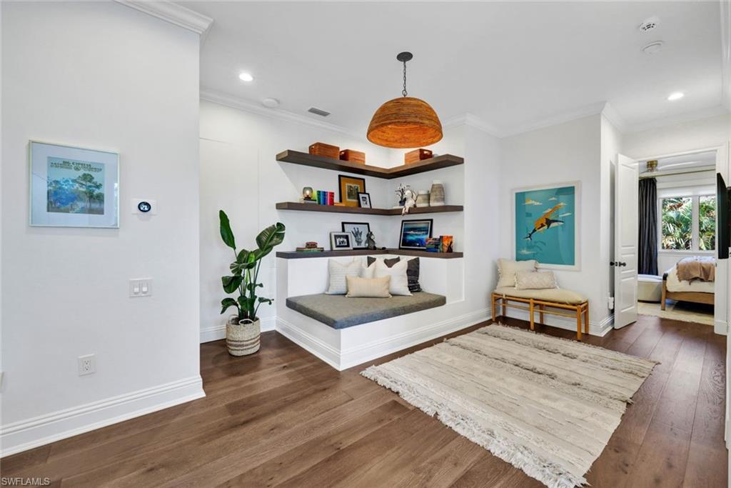 445 Putter Point Drive Naples, FL 34103 - Photo 29 of 44 a living room with furniture and wooden floor