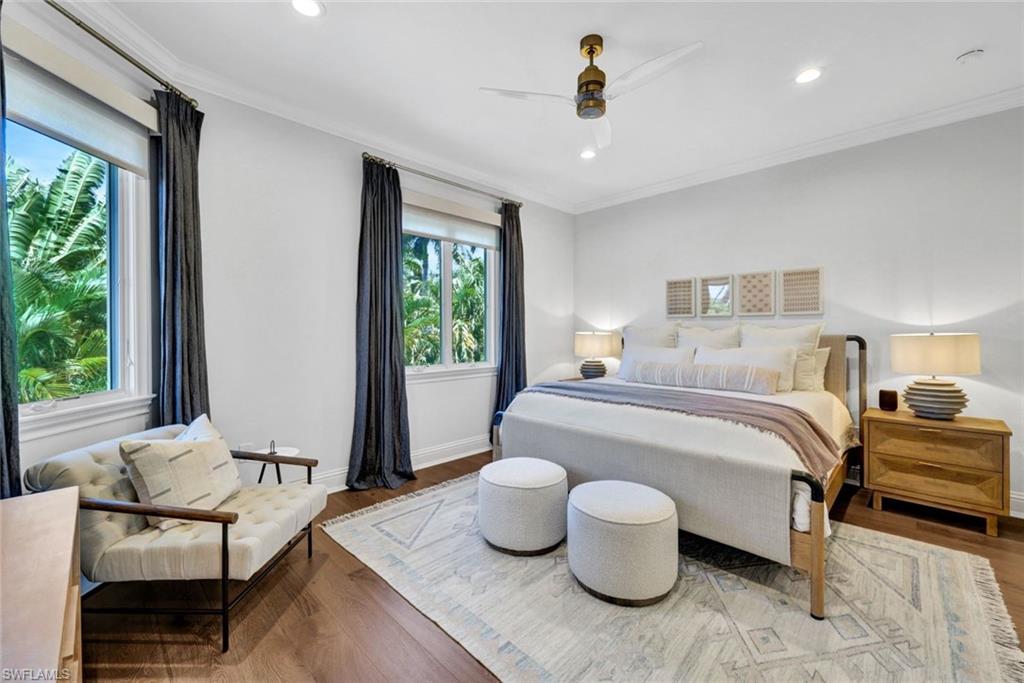 445 Putter Point Drive Naples, FL 34103 - Photo 30 of 44 a bedroom with furniture and a window
