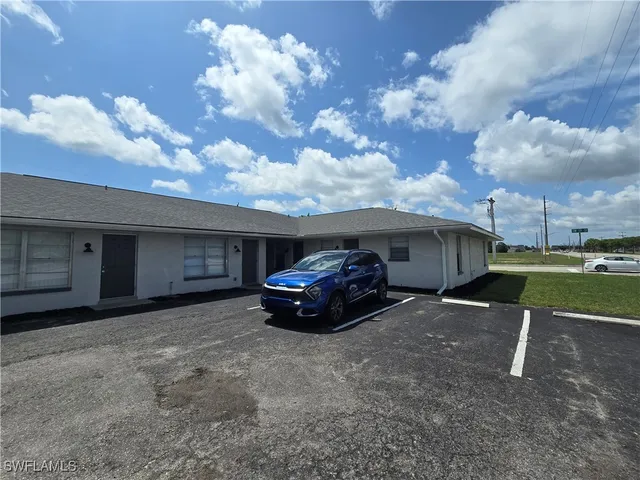 a car parked in front of a house