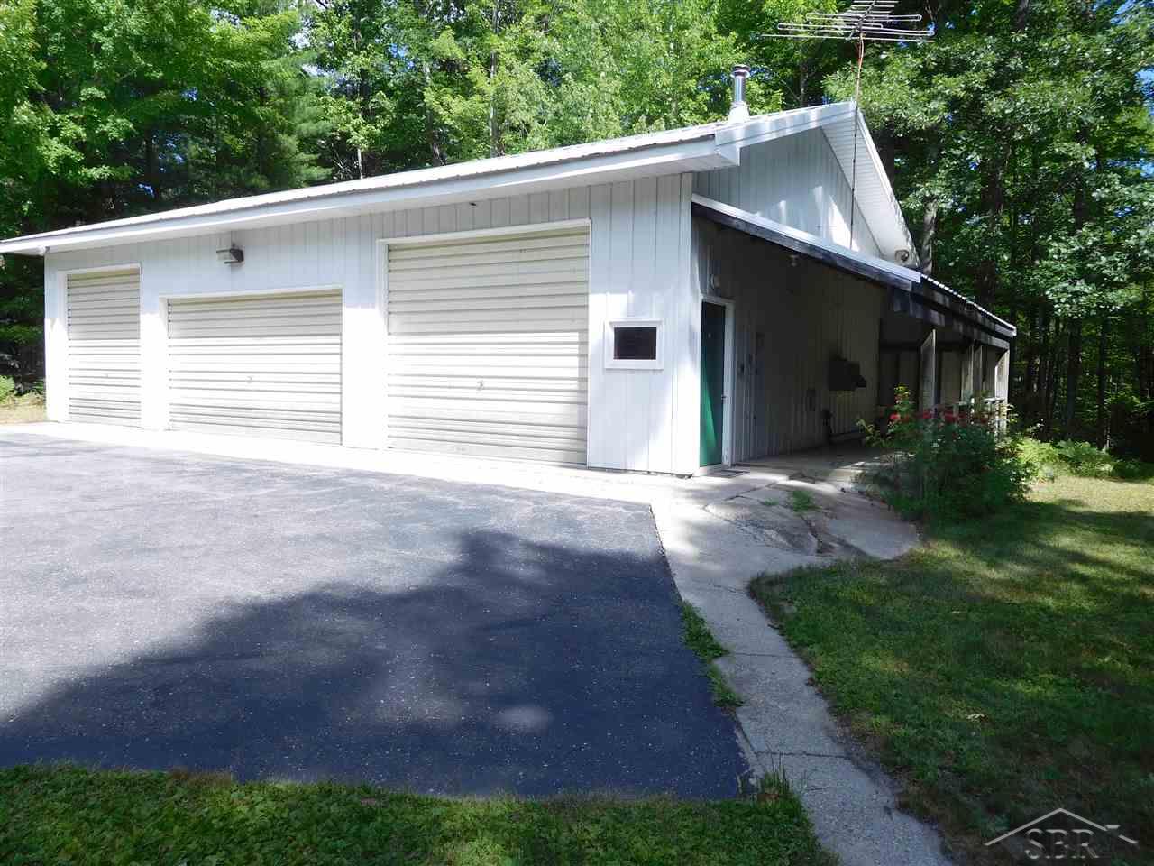 1330 Stoney Ridge Road West Branch, MI 48661 - Photo 15 of 20 Enough room for 4 vehicles. One part is set up with lots of electrical outlets and work bench.