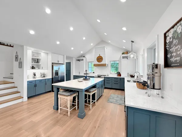 a bathroom with a sink a mirror and a bathtub