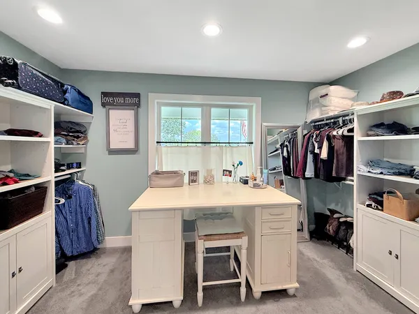 a kitchen with a sink and a large window