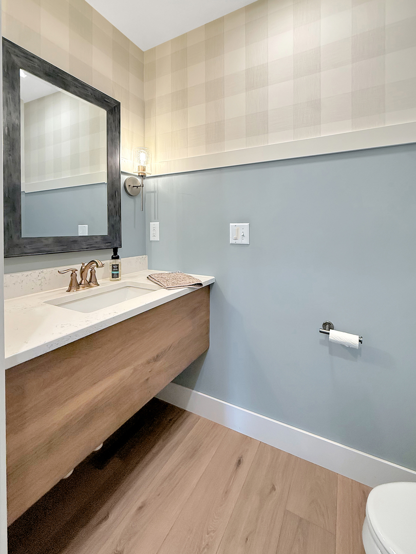 4567 West Stephenson St Road Freeport, IL 61032 - Photo 35 of 65 a bathroom with a sink and a mirror