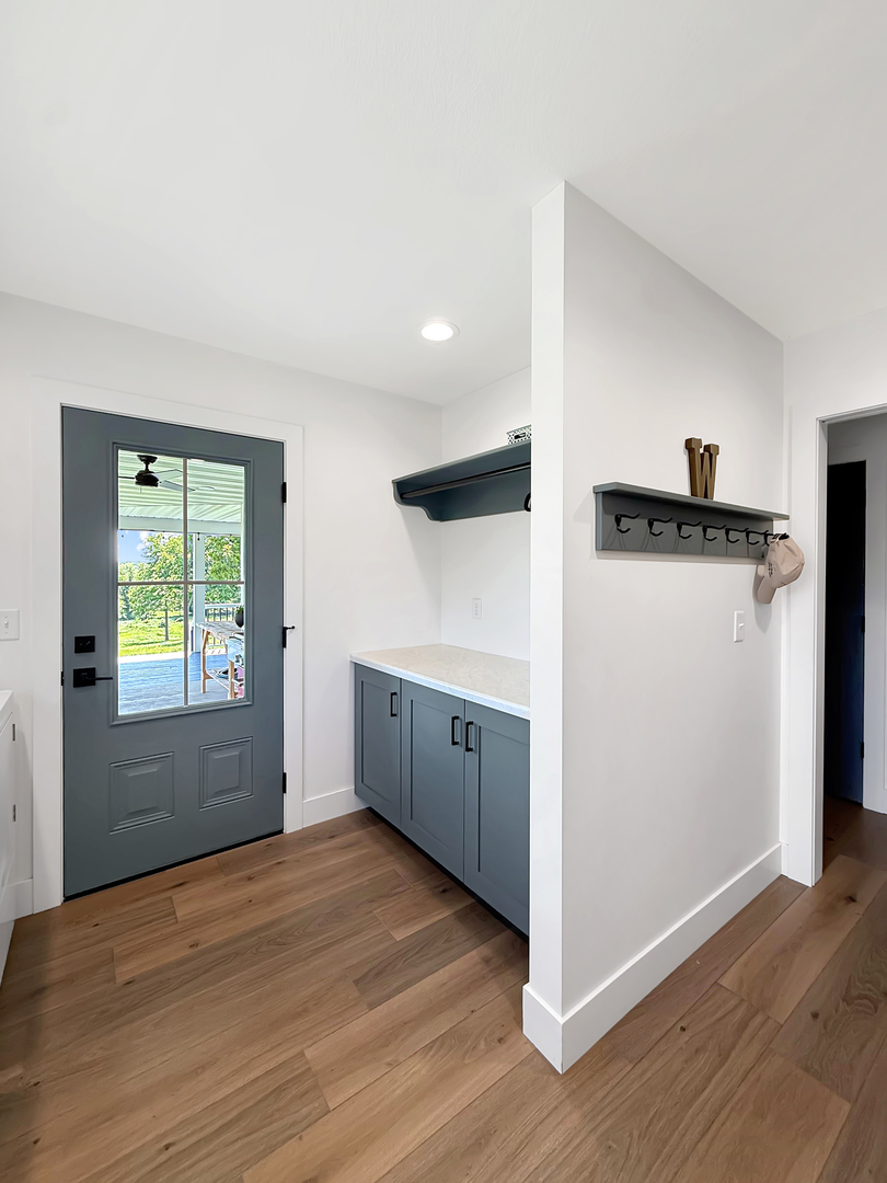 4567 West Stephenson St Road Freeport, IL 61032 - Photo 36 of 65 a view of a kitchen with wooden floor and a hallway