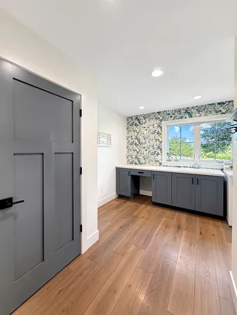 a bedroom with a bed and a mirror