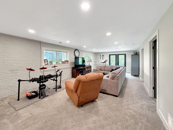 a bedroom with furniture and a window