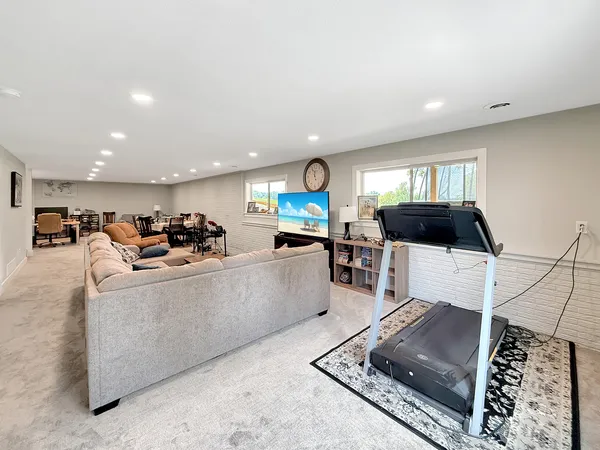 a bedroom with a bed and a ceiling fan