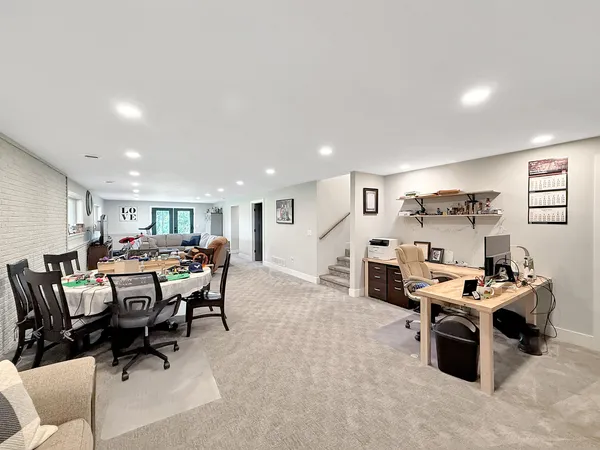 a view of a livingroom with furniture and a ceiling fan