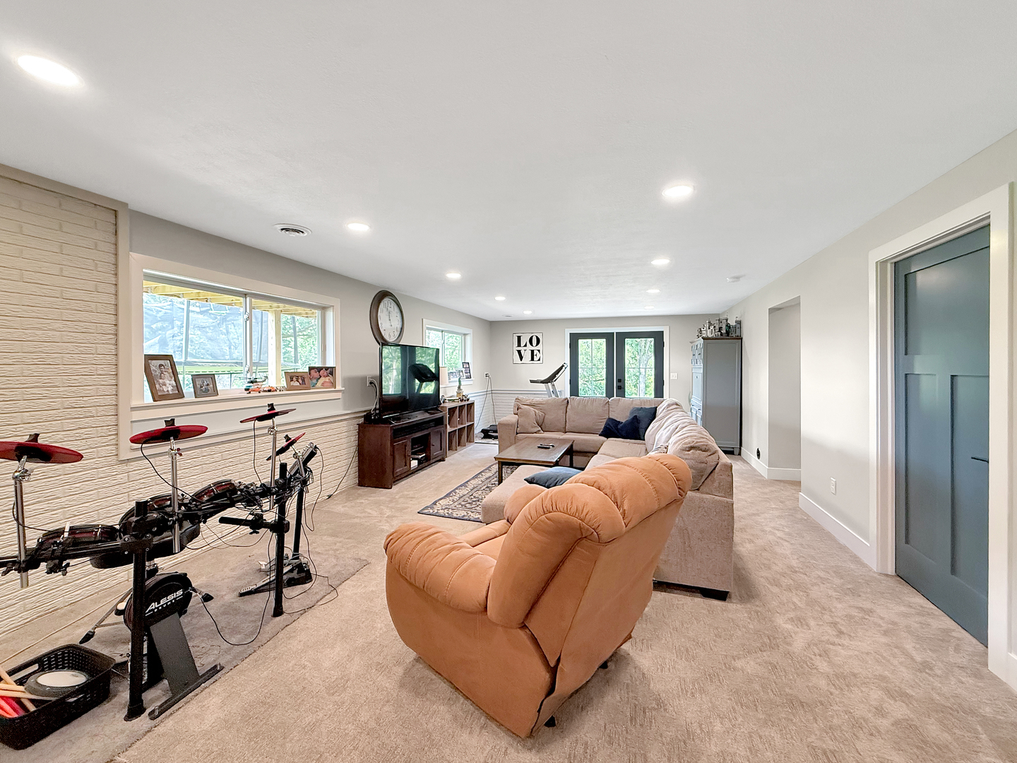 4567 West Stephenson St Road Freeport, IL 61032 - Photo 47 of 65 a living room with furniture potted plant and a large window