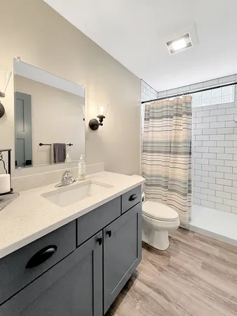 a view of a backyard with a garden and entertaining space