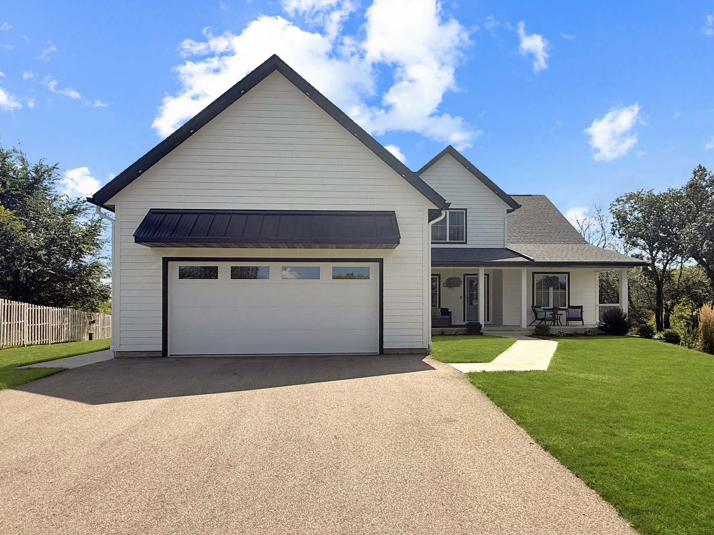 4567 West Stephenson St Road Freeport, IL 61032 - Photo 5 of 65 a front view of a house with a yard and garage