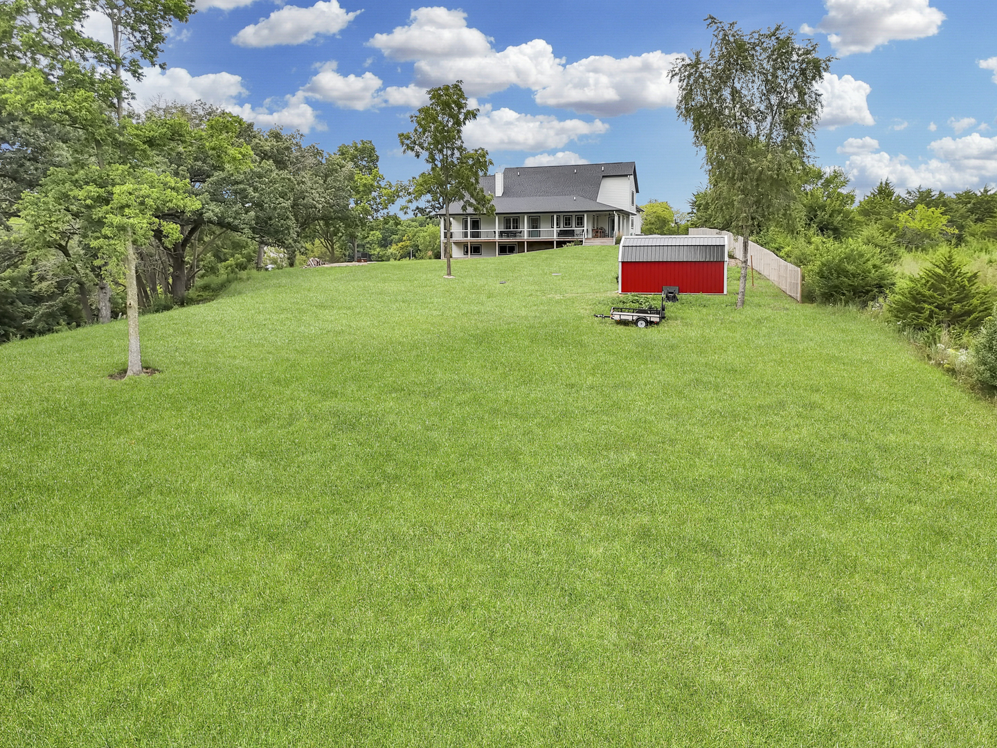 4567 West Stephenson St Road Freeport, IL 61032 - Photo 61 of 65 a view of a backyard with a garden and entertaining space
