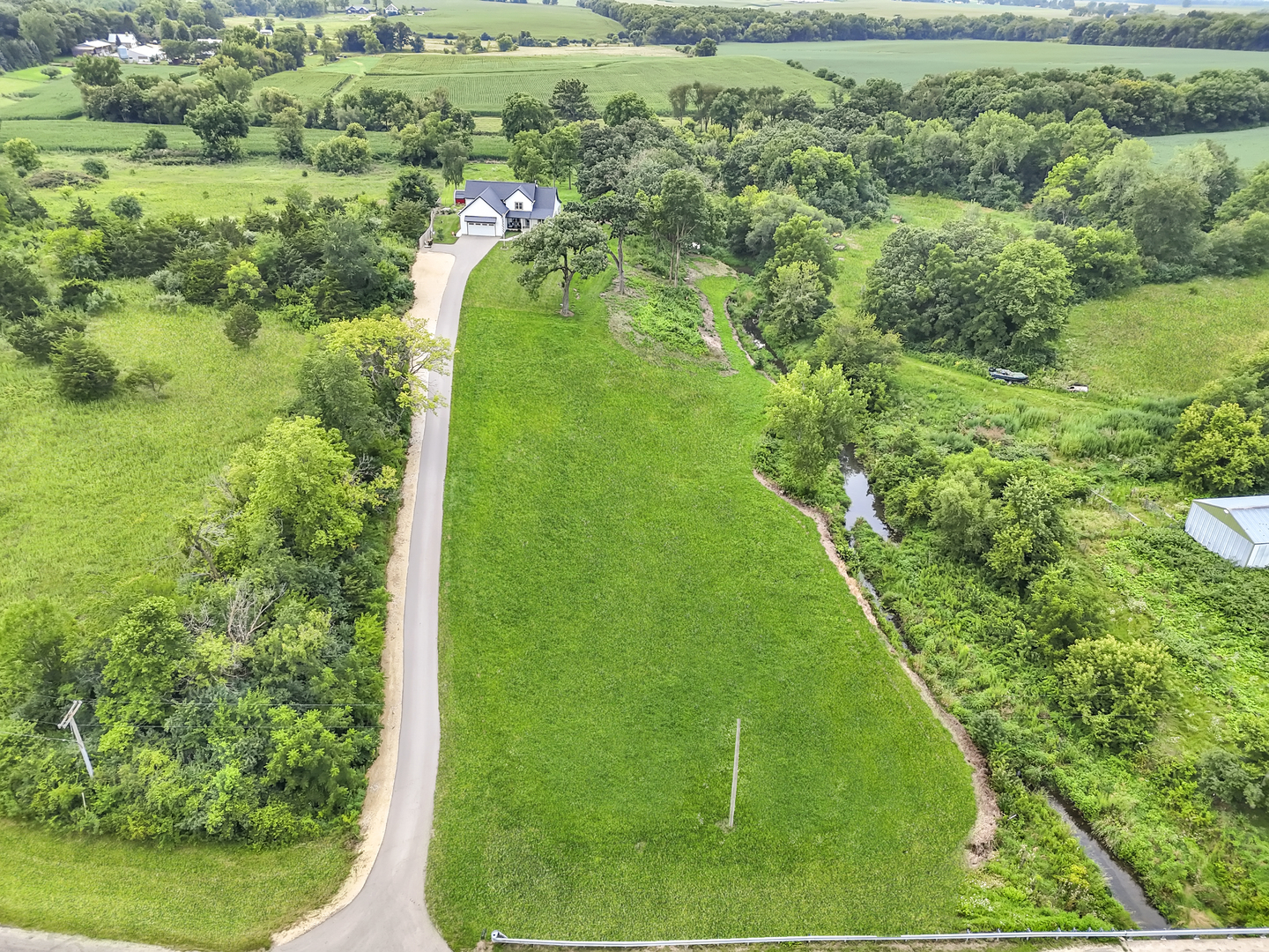 4567 West Stephenson St Road Freeport, IL 61032 - Photo 62 of 65 a view of a green yard with large trees