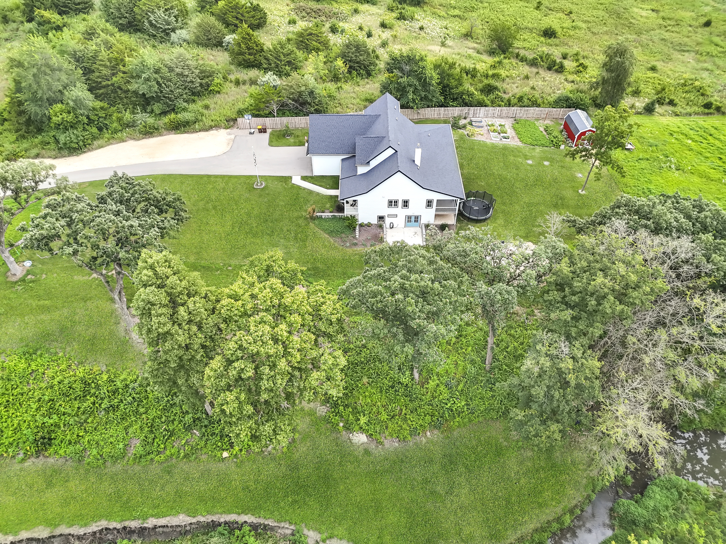 4567 West Stephenson St Road Freeport, IL 61032 - Photo 64 of 65 an aerial view of residential house with outdoor space and trees all around