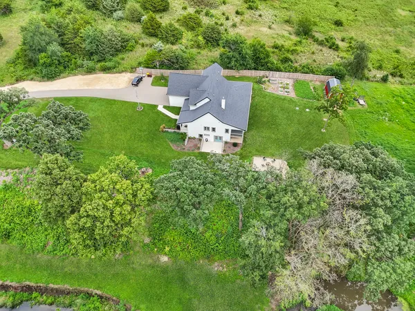 a living room with furniture and a wooden deck