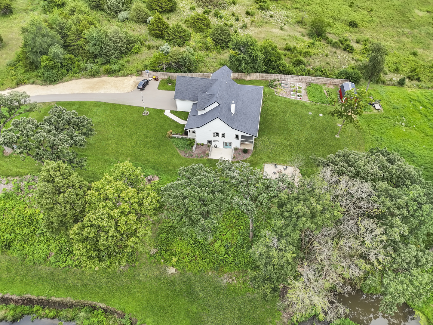 4567 West Stephenson St Road Freeport, IL 61032 - Photo 8 of 65 an aerial view of a house with a yard and lake view