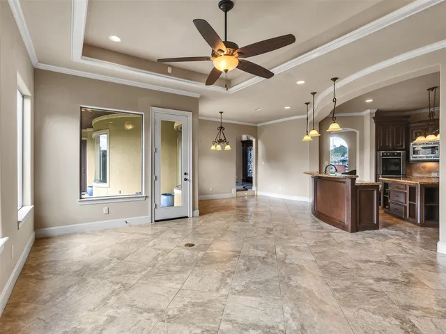 a view of a livingroom with a kitchen