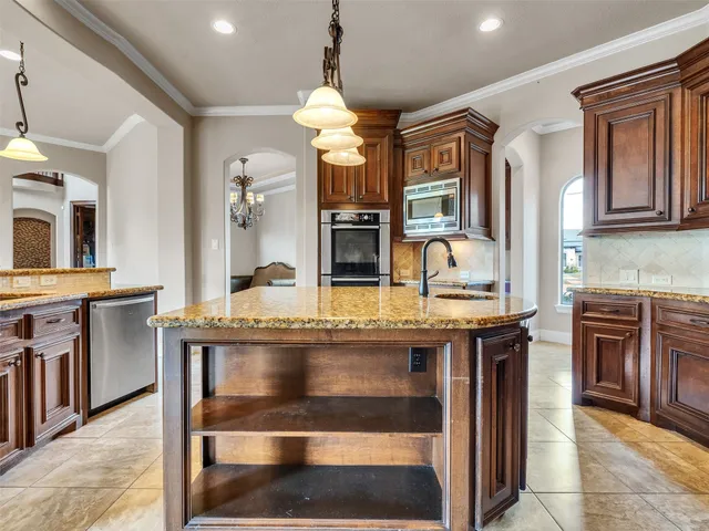 a kitchen with cabinets and outdoor seating