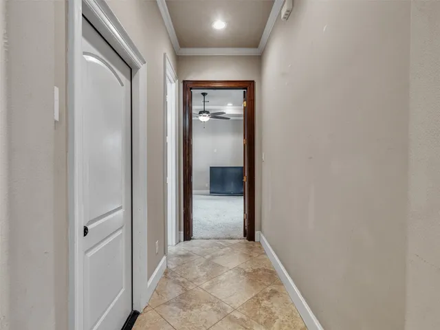a view of hallway with wooden floor