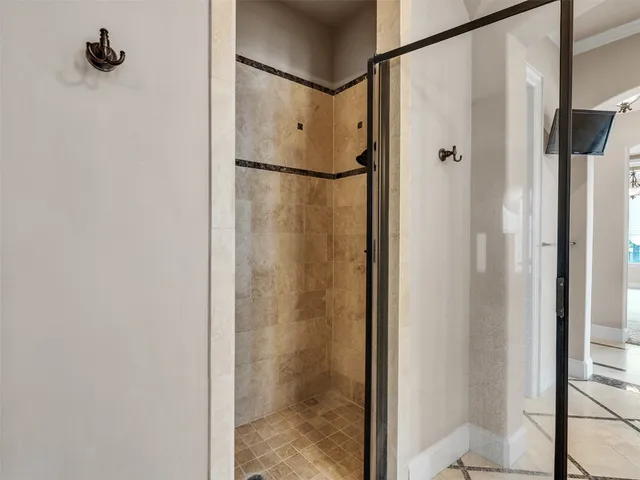 a bathroom with a shower and a sink