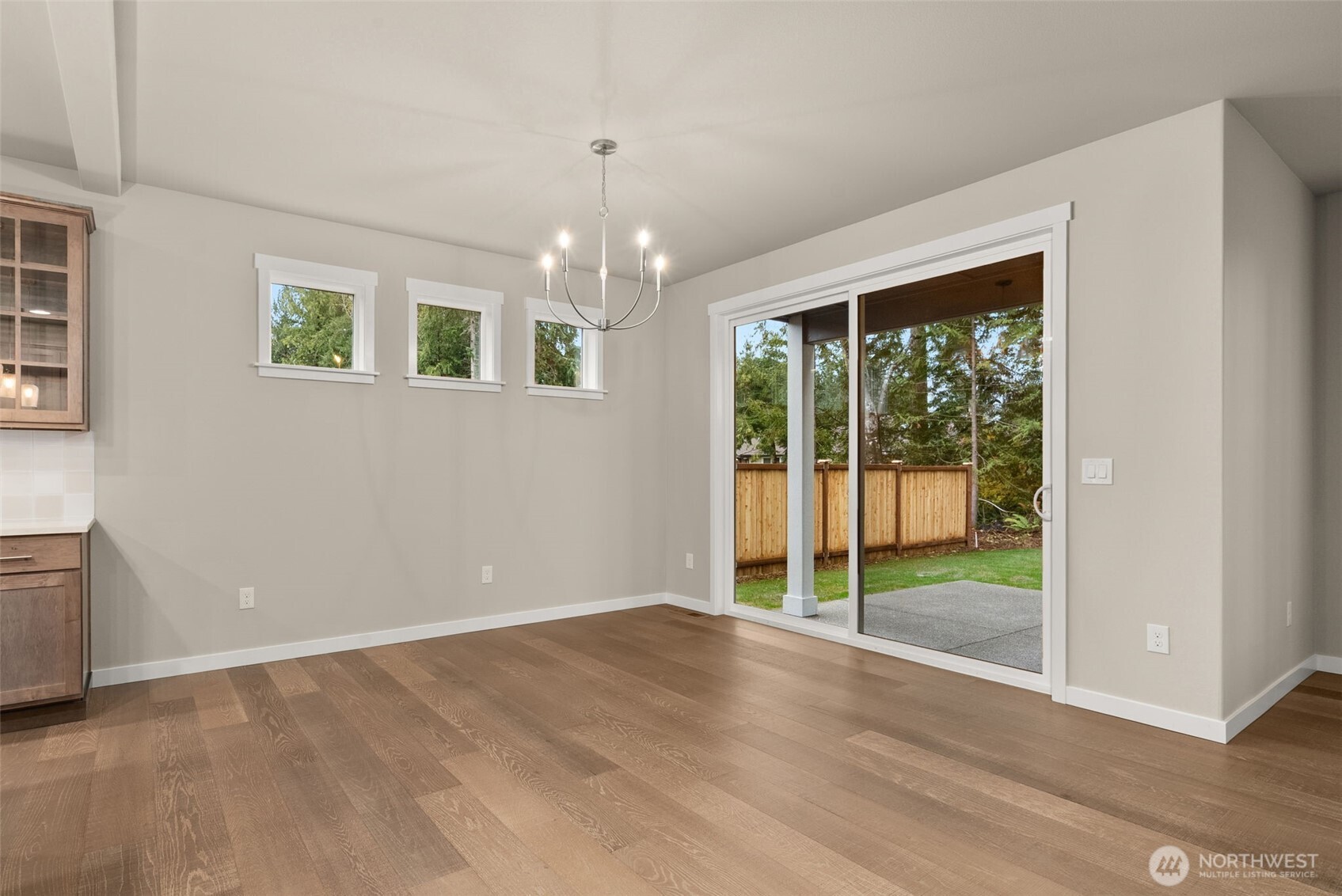 5654 Mimi Street Southwest Tumwater, WA 98512 - Photo 11 of 38 a view of an empty room with wooden floor and a window