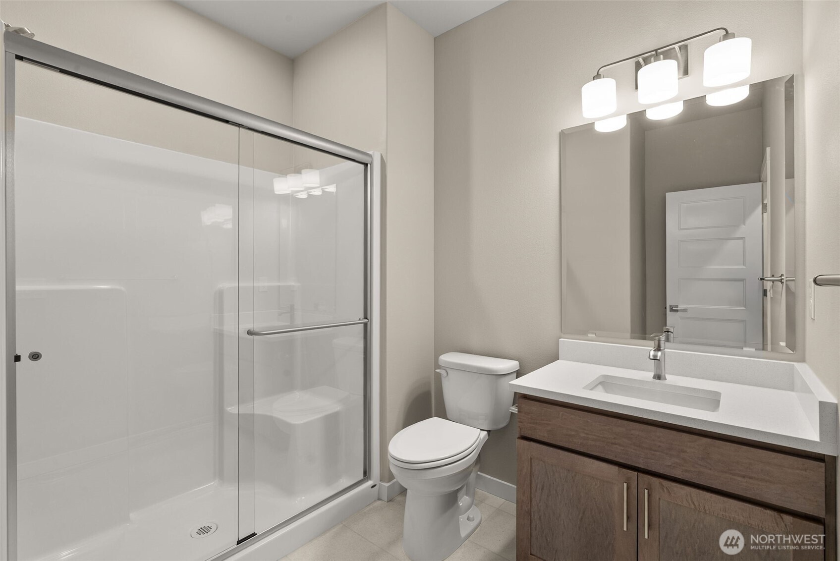 5654 Mimi Street Southwest Tumwater, WA 98512 - Photo 13 of 38 a bathroom with a toilet sink and shower