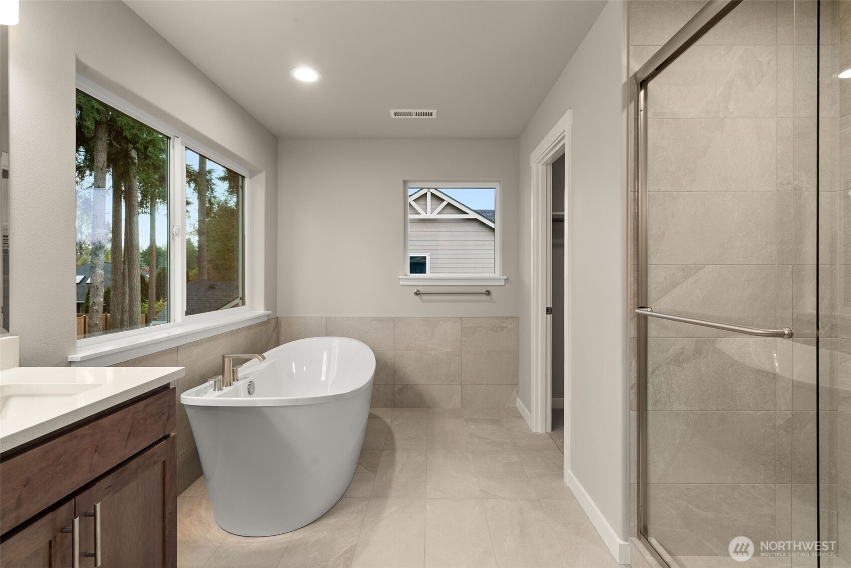 5654 Mimi Street Southwest Tumwater, WA 98512 - Photo 19 of 38 a bathroom with a sink and a mirror