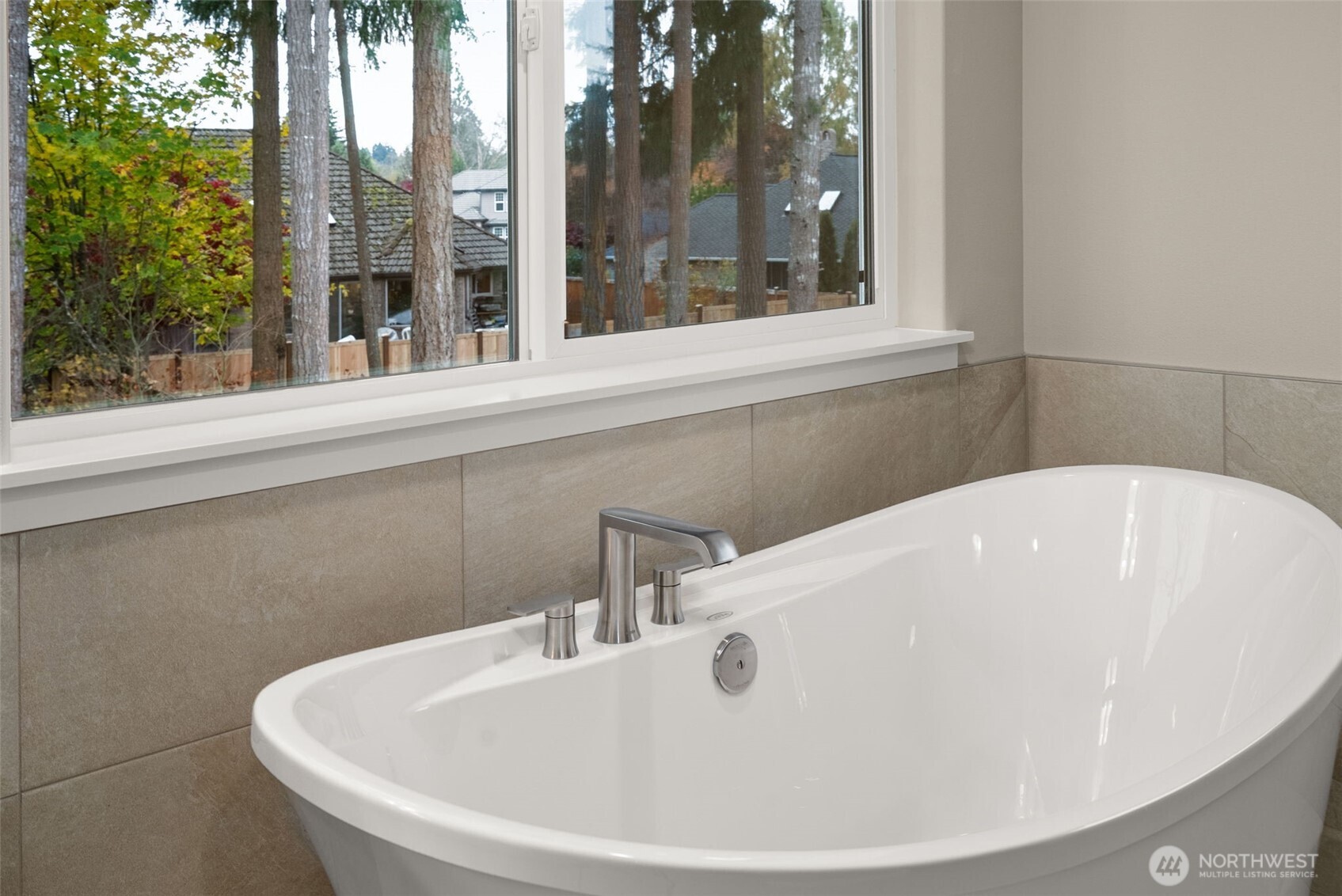 5654 Mimi Street Southwest Tumwater, WA 98512 - Photo 22 of 38 a white bath tub sitting in front of a window