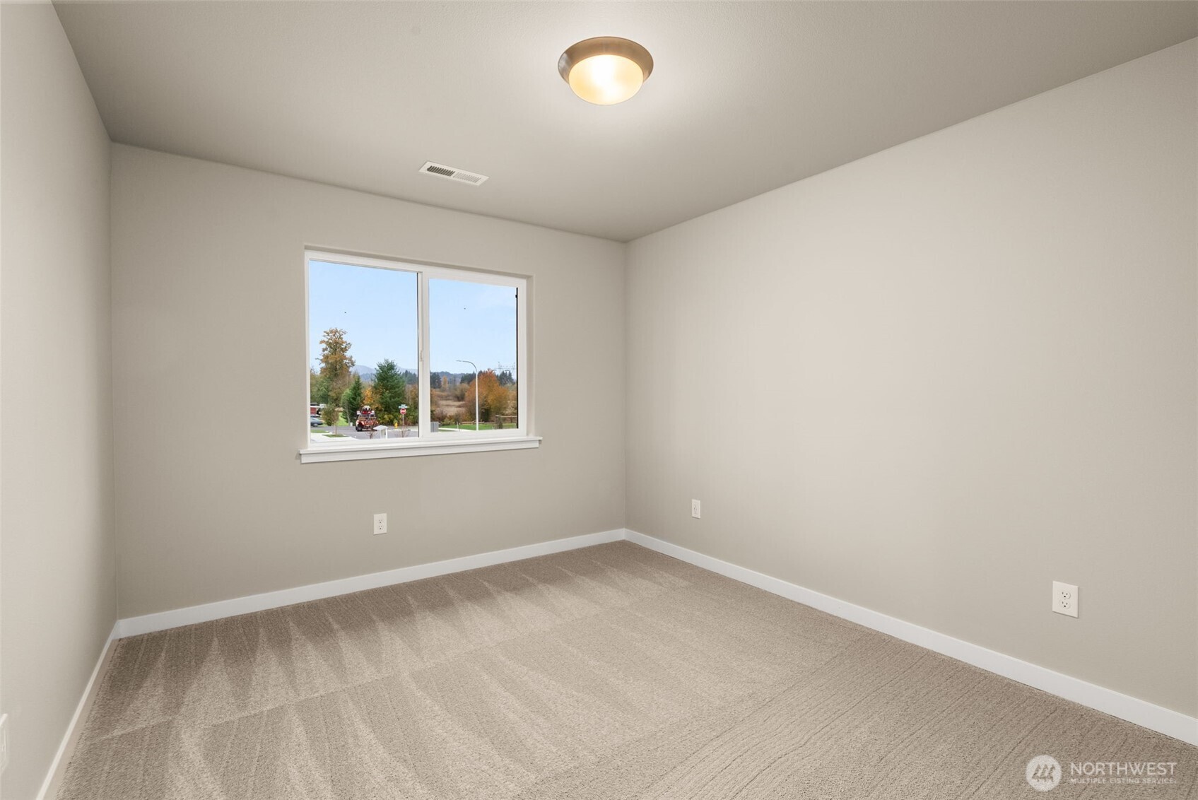 5654 Mimi Street Southwest Tumwater, WA 98512 - Photo 27 of 38 an empty room with a window
