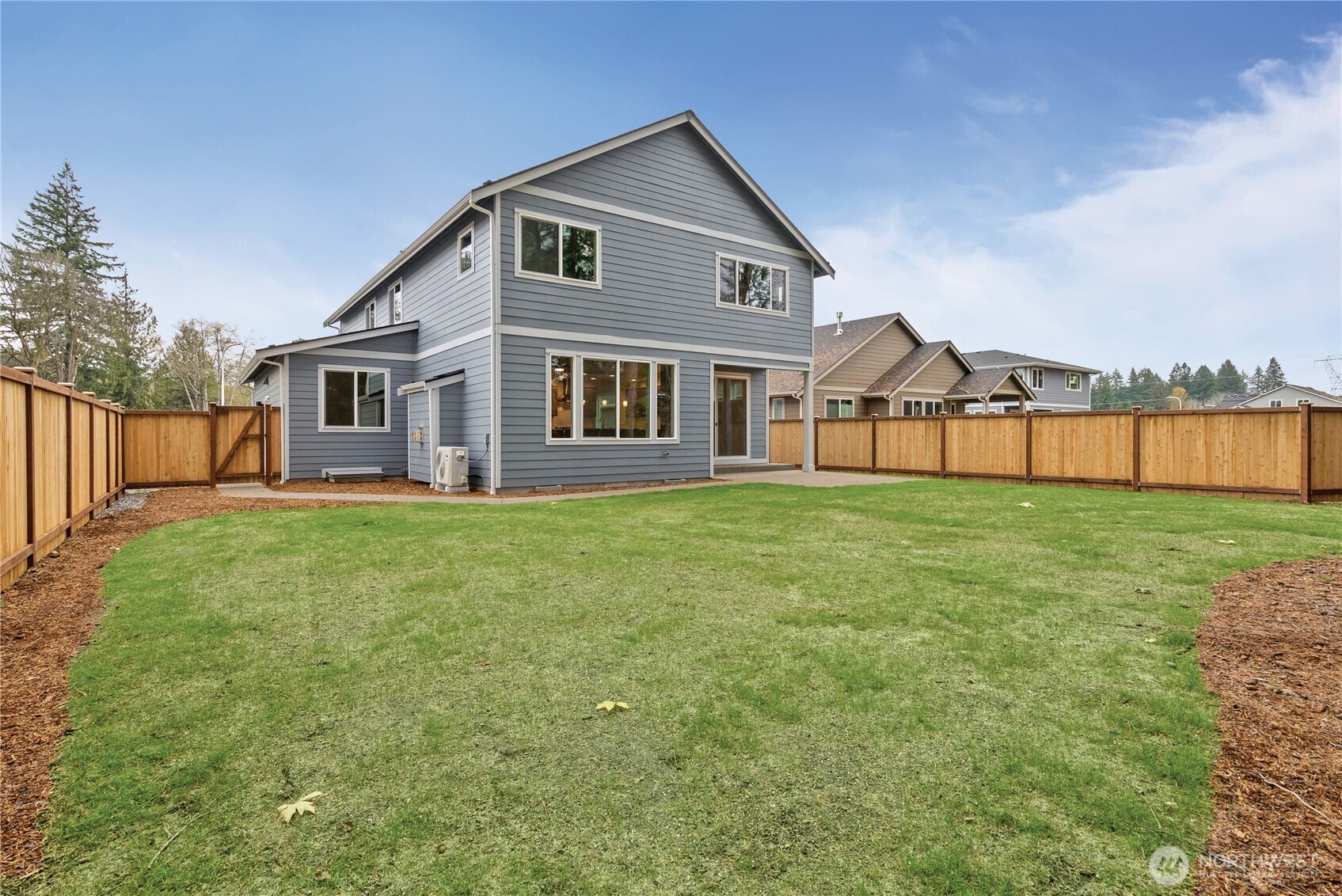 5654 Mimi Street Southwest Tumwater, WA 98512 - Photo 36 of 38 a front view of house with yard and green space