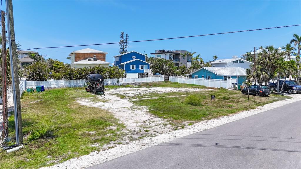 777 Jacaranda Road Anna Maria, FL 34216 - Photo 5 of 30 a view of a house with backyard and sitting area