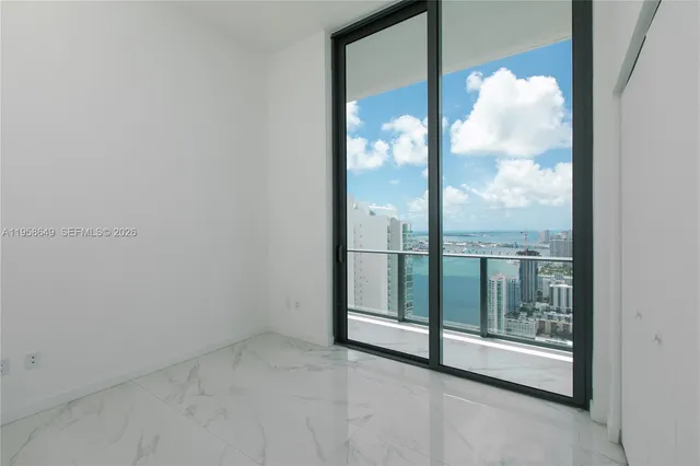 a view of an empty room and window