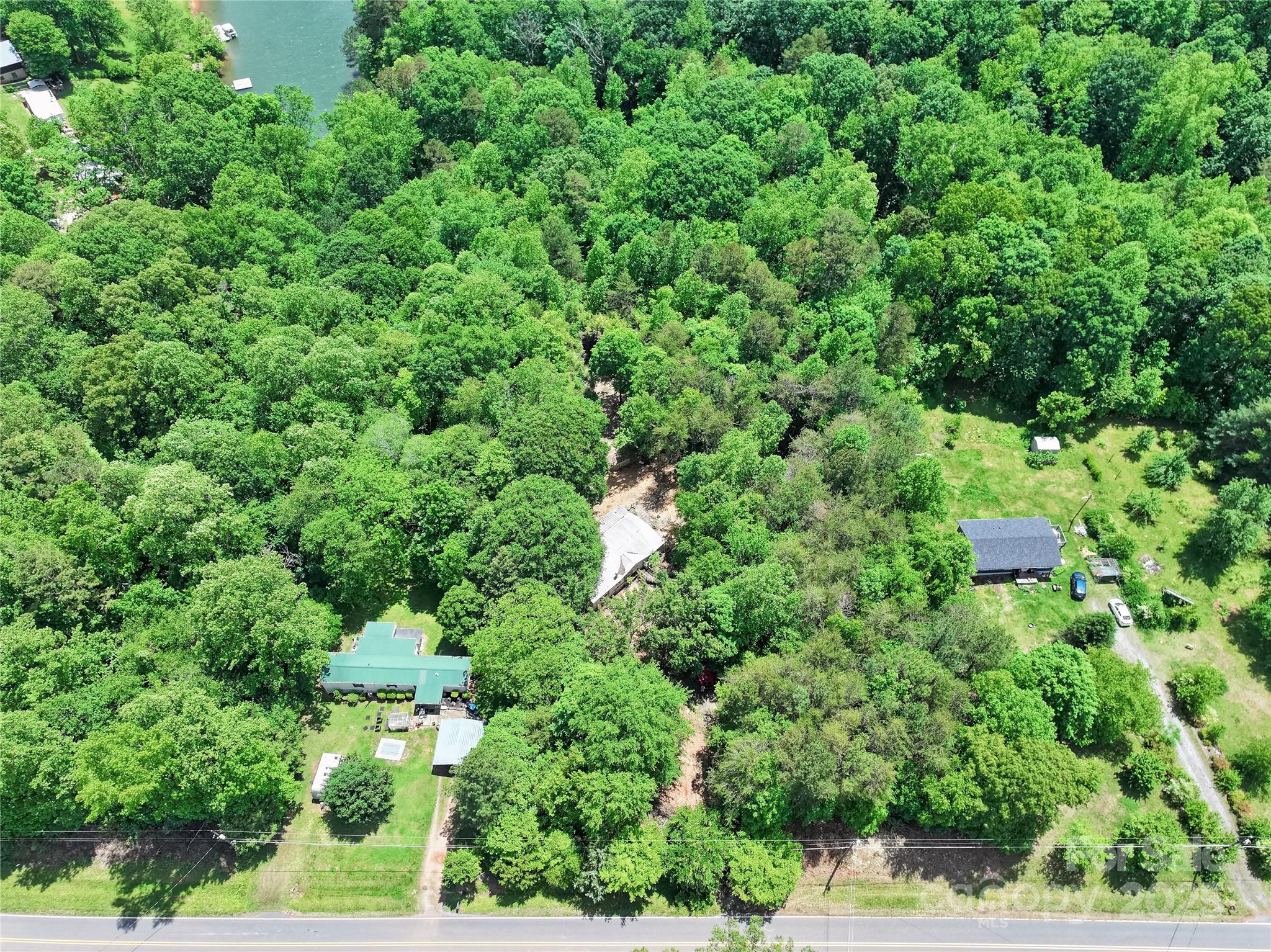 4585 Sunrise Beach Road Catawba, NC 28609 - Photo 16 of 32 an aerial view of residential house with outdoor space and trees all around