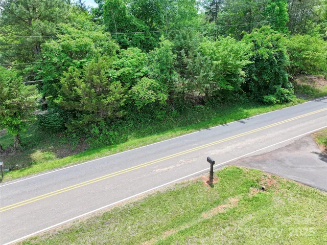 a view of a backyard with potted plants
