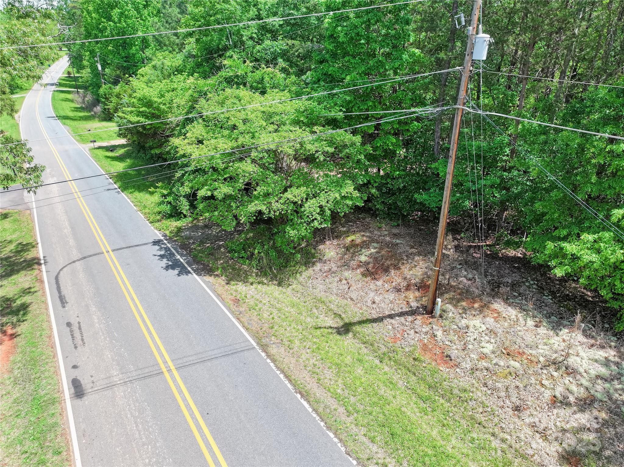 4585 Sunrise Beach Road Catawba, NC 28609 - Photo 23 of 32 a view of a backyard with potted plants