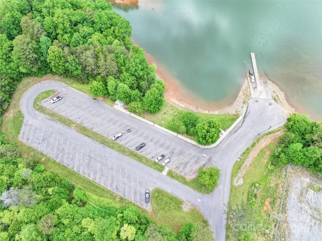 a view of a swimming pool with a yard