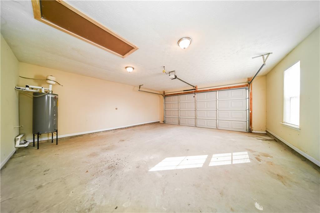 11171 Knotty Pine Place Hampton, GA 30228 - Photo 21 of 26 a view of a garage