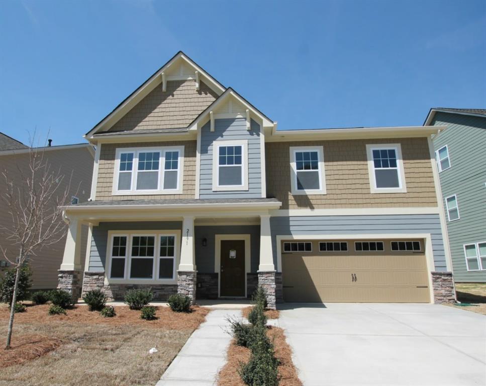 2191 Bluebell Way, Unit 11 Tega Cay, SC 29708 - Photo 1 of 14 a front view of a house with a yard