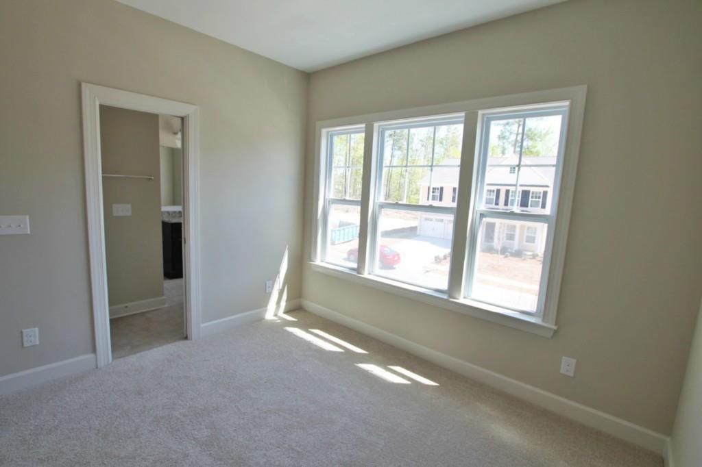 2191 Bluebell Way, Unit 11 Tega Cay, SC 29708 - Photo 12 of 14 an empty room with a empty space and windows