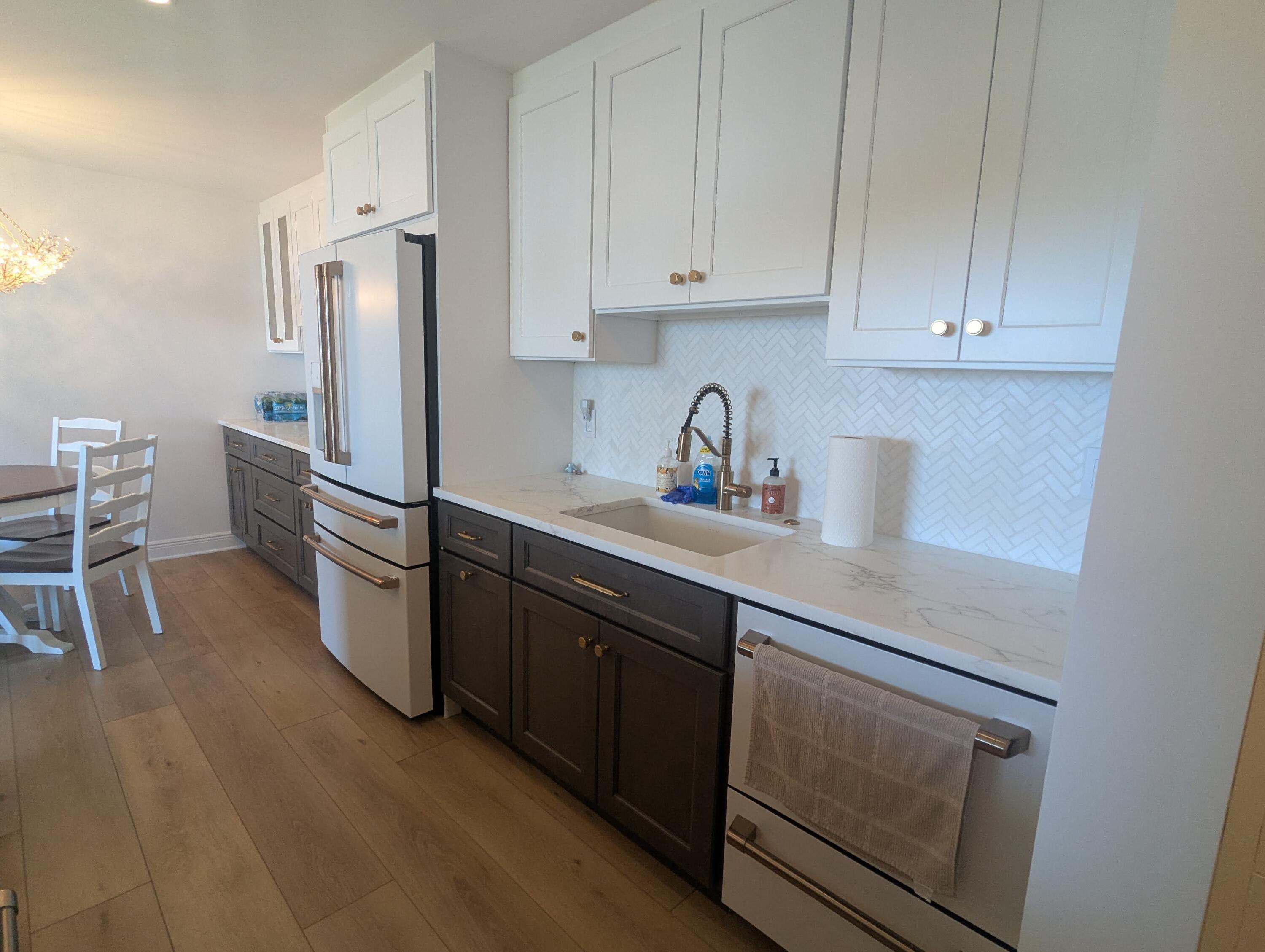 2121 North Ocean Boulevard, Unit 1006E Boca Raton, FL 33431 - Photo 6 of 64 a kitchen with stainless steel appliances a refrigerator sink and cabinets