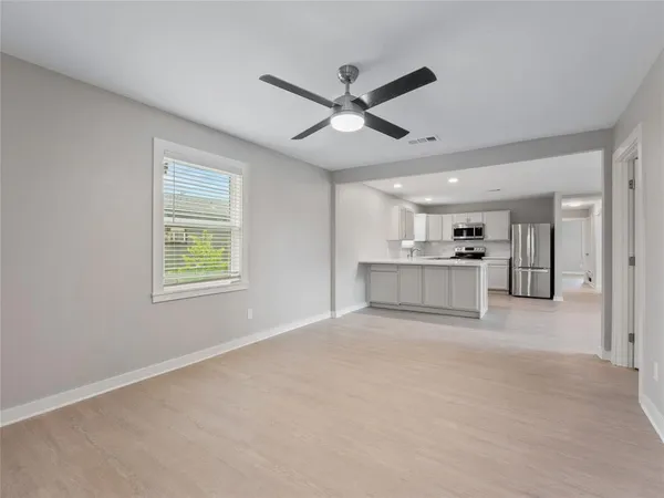 a view of an empty room with a window