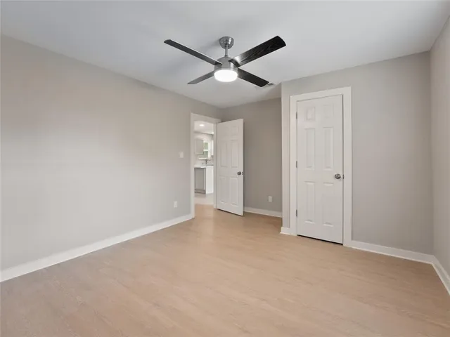a bathroom with a double vanity sink a mirror and a shower