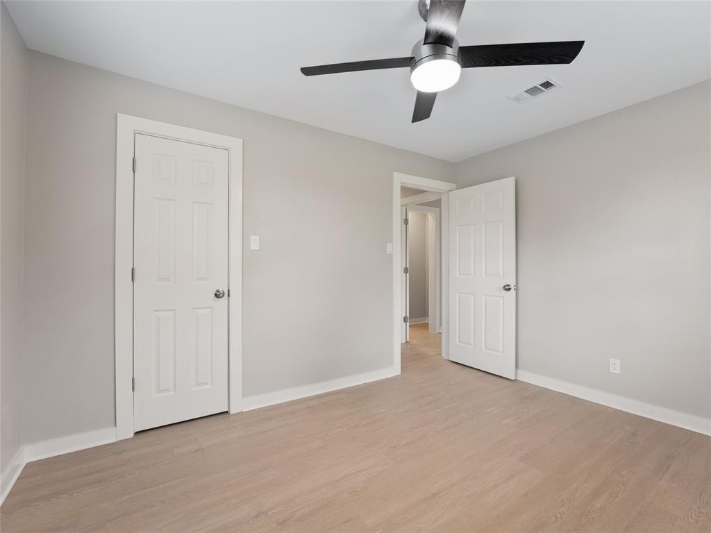421 South Interurban Street Anna, TX 75409 - Photo 18 of 27 a view of an empty room and chandelier fan