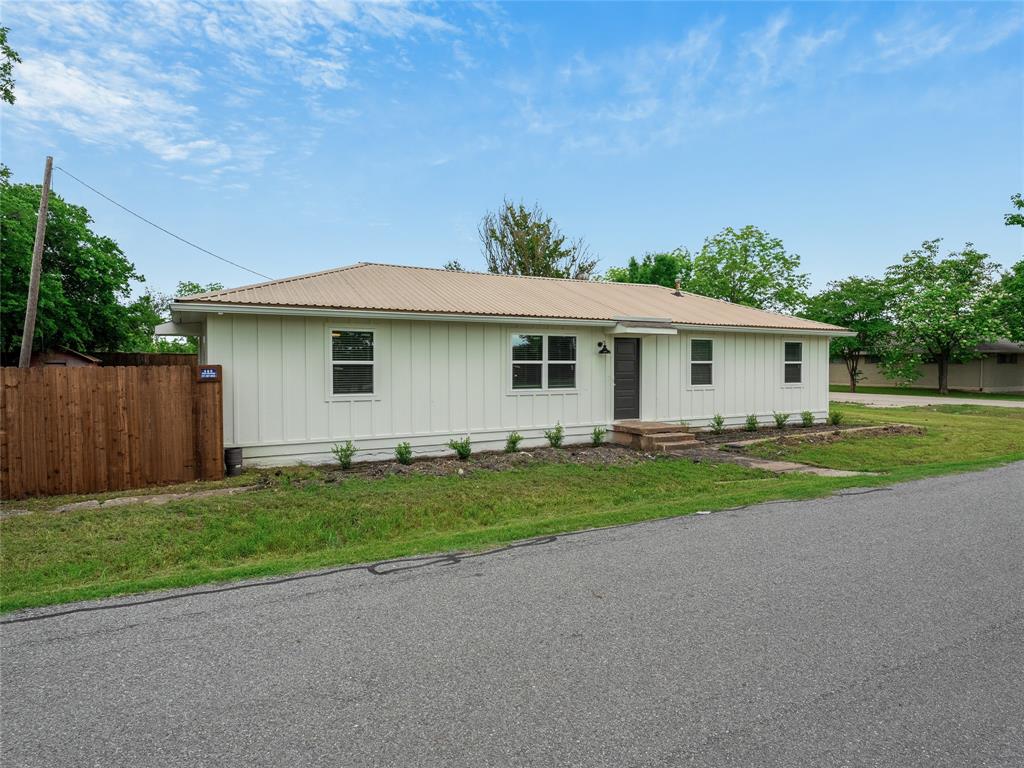421 South Interurban Street Anna, TX 75409 - Photo 26 of 27 a front view of a house with a yard and garage