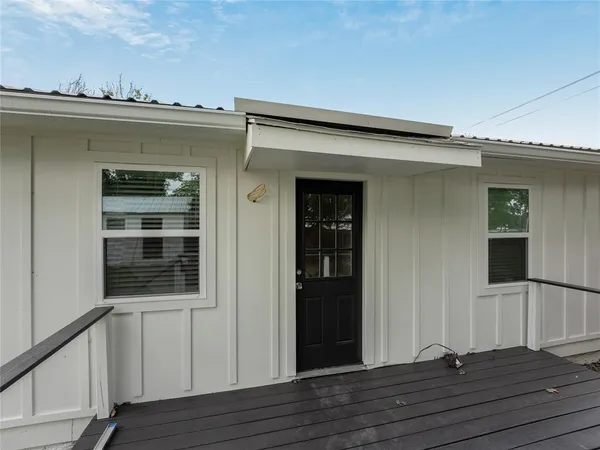 a view of a kitchen with a sink and cabinet area