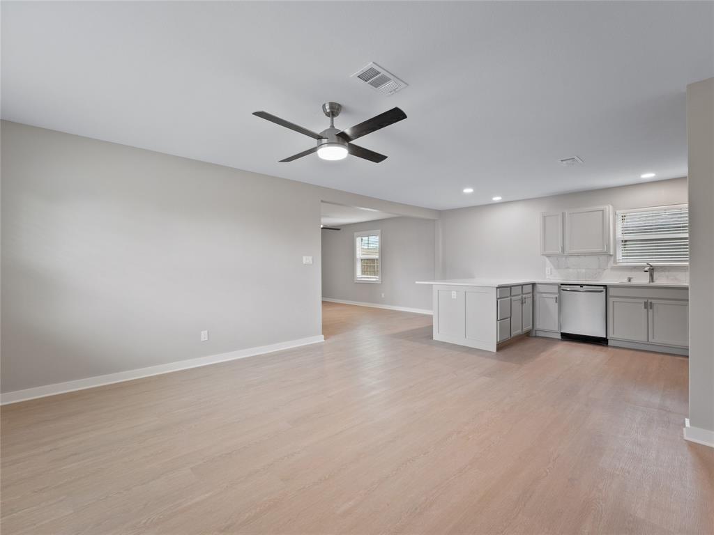 421 South Interurban Street Anna, TX 75409 - Photo 6 of 27 a view of an empty room with a kitchen