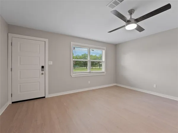 a view of an empty room with a window